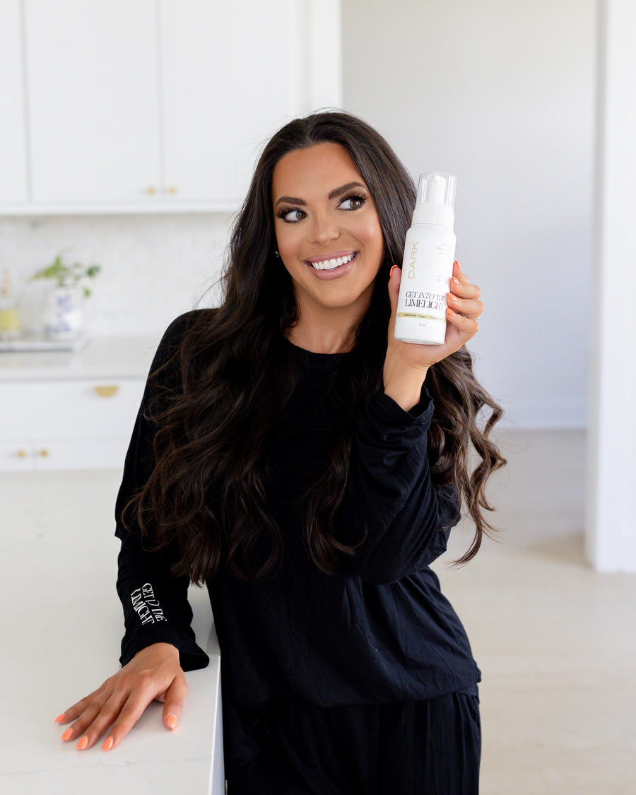 Lindsay Schneider holding Get Into The Limelight self-tanner