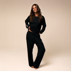 Model wearing black bamboo tanning pajamas #black