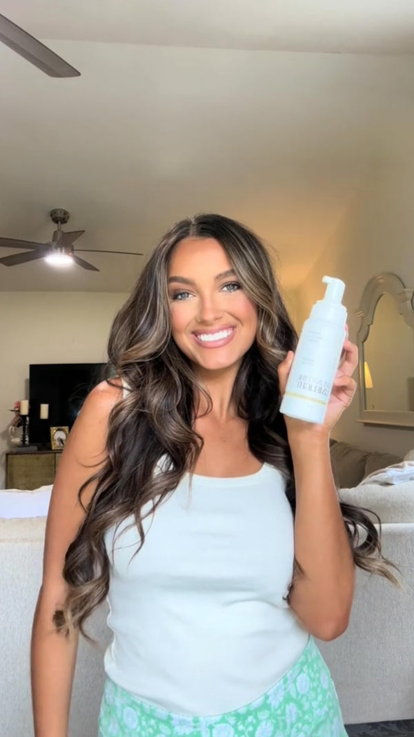 @lainey_michelle holding Get Into The Limelight self tanning mousse